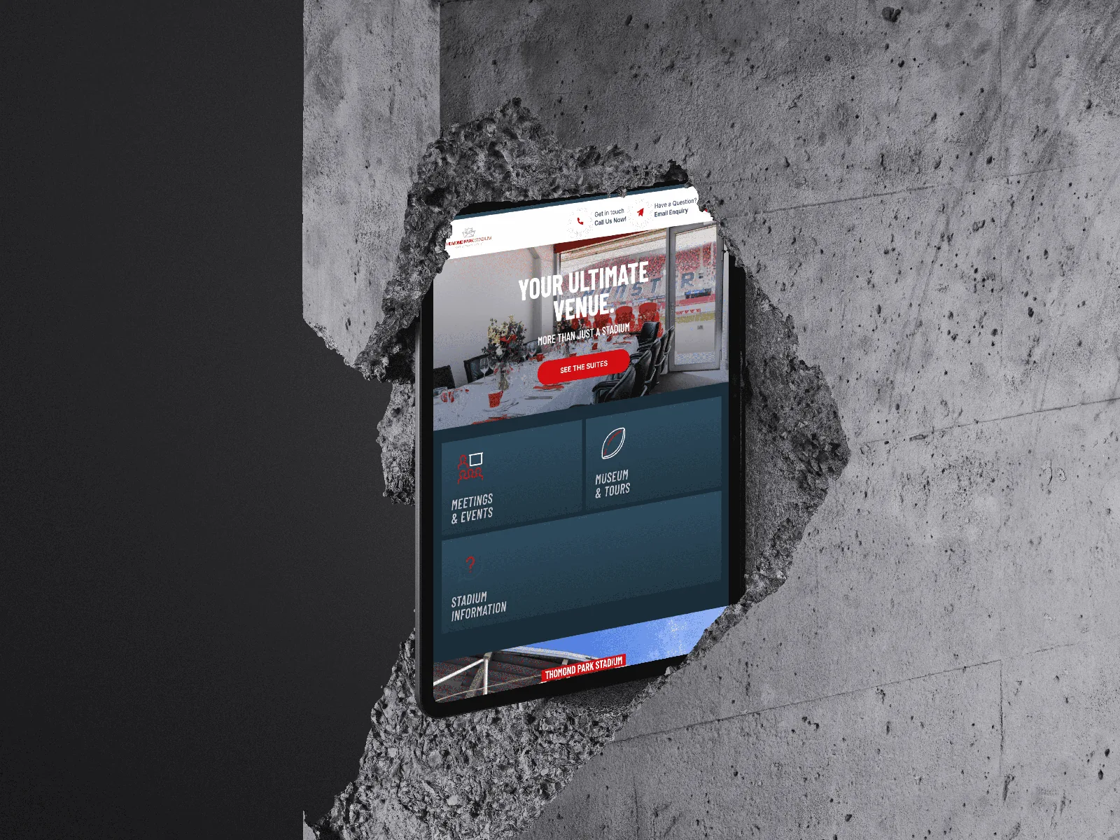 Tablet displaying venue website design for events and stadium information.